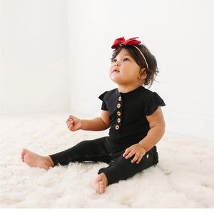 Posh Peanut Black Ribbed Ruffled Cap Sleeve Henley Romper